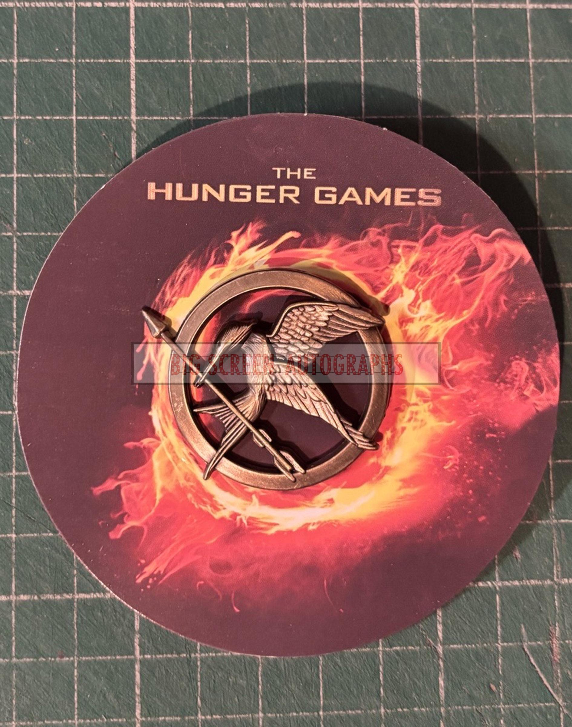 Huger Games Pin The Hunger Games promo pin badge | Big Screen Autographs